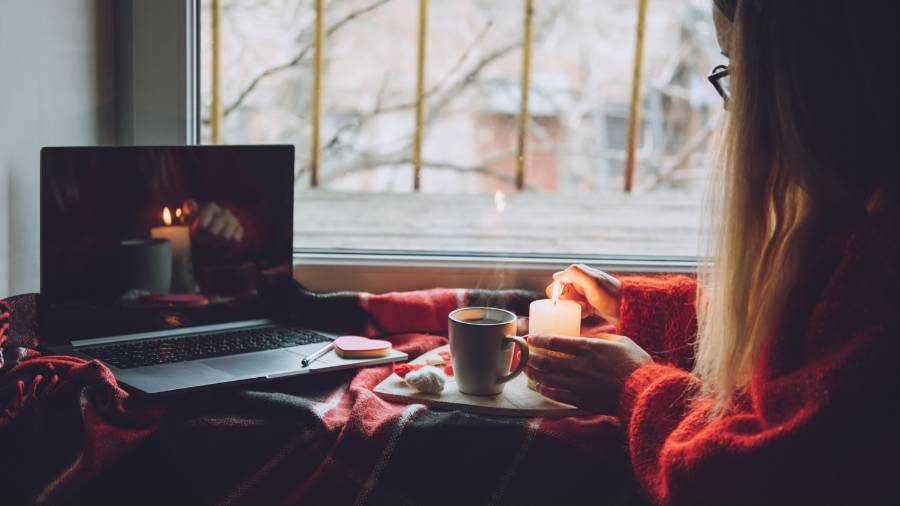 Woman in Long Distance Relationship Lighting Candle