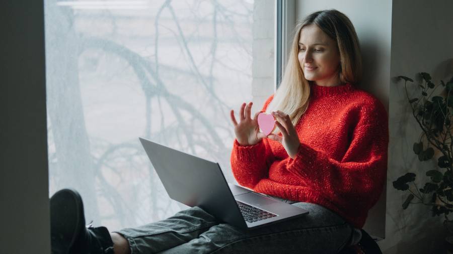 Woman Using Online Dating App on Laptop. 