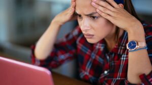 looking at laptop stressed