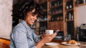 Smiling Woman Using Smart Phone