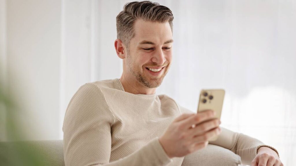 smiling looking at phone