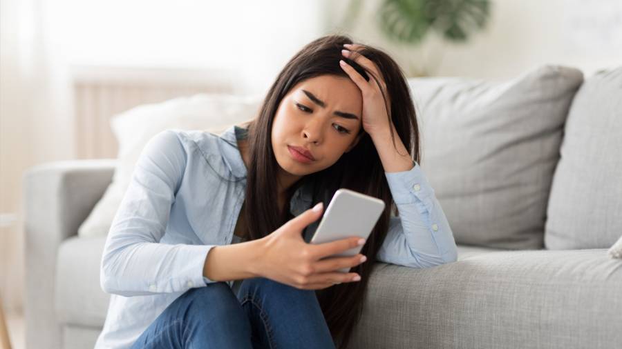 sad looking at phone