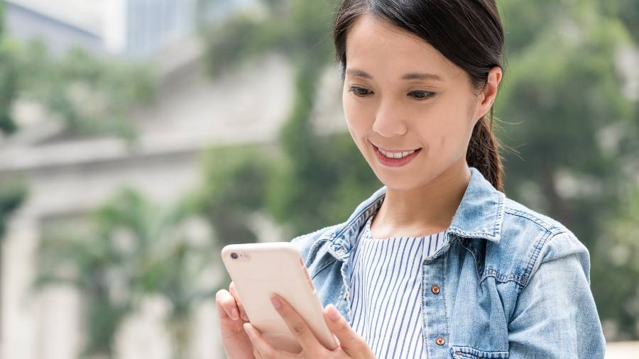 smiling looking at phone