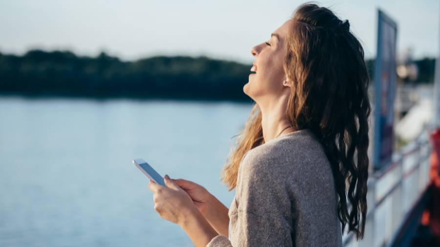 laughing at phone