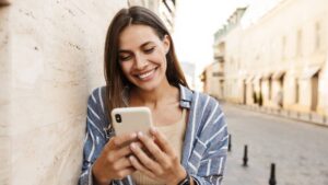 Happy Woman Using a Smart Phone