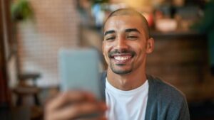 smiling at cellphone