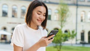 Young Beautiful Asian Woman Using Phone