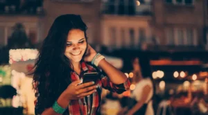A person using a dating app while reading online dating tips for finding a real connection
